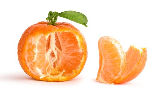 the opened tangerine with leaf isolated