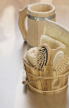 bucket and mug on wooden background
