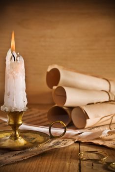 candle and old roll of paper