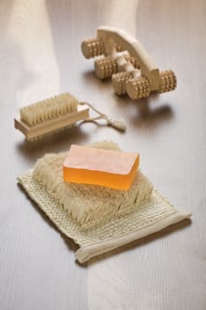 massager hairbrush and soap on bast