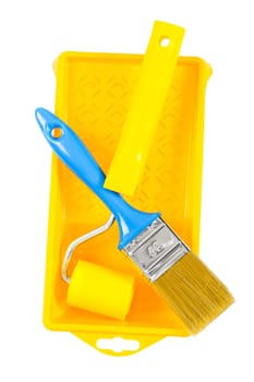 paintroller and paintbrush on paintbox