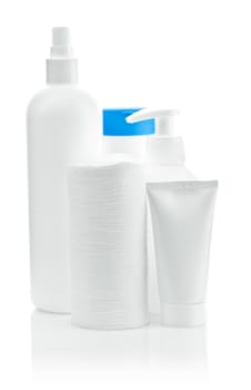 three bottles with pads and tube