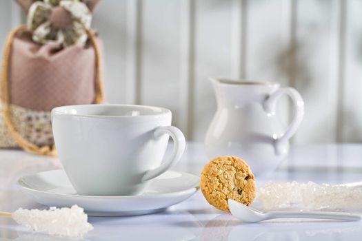 white coffee items on white table