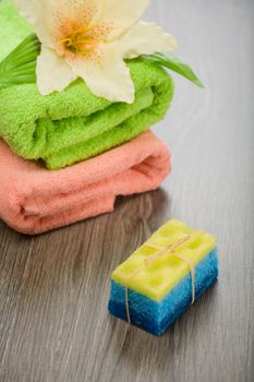 bath sponge soap flower and towels
