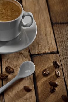 coffee cup and spoon on wooden table