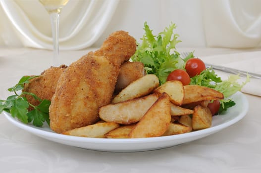 Chicken drumsticks in breadcrumbs with chips   with salad