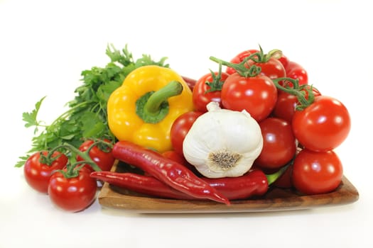 different varieties of vegetables in front of white background