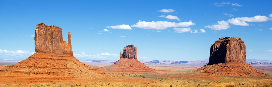 panoramic view of famous Monument Valley with blue sky, USA