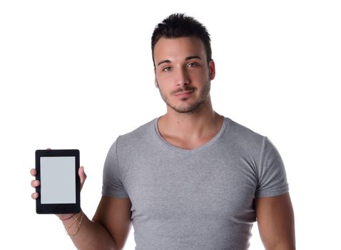 Handsome young man holding and showing ebook reader, blank display, isolated on white
