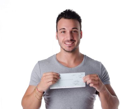 Happy, smiling young man with check (cheque) in hands, looking at camera