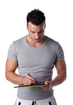 Athletic young man using digital graphic tablet to draw sketch