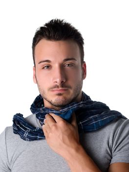 Suffering young man with scarf, holding his neck because of throat ache