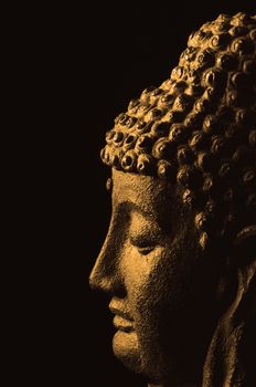 meditating buddha on black background