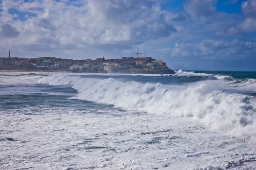 Sea wave and spray in Whitby beach, Yorkshire, England