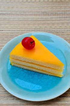 Orange cake in blue dish, Sweet dessert