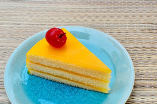 Orange cake in blue dish, Sweet dessert