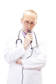 Shy male physician speaking in his microphone