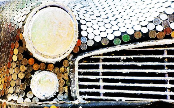 Horizontal color landscape captured at the Kala Ghoda Festival 2013 held annually, exhibit by and credit Hetal Shukla. An ambassador, iconic Indian car model covered in rupee coins - the national currency of India.