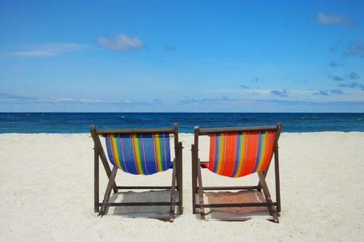 Beach chair with sea and sky background