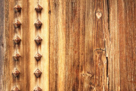 Texture of ancient wood with rivets