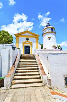 Light house and church in Macau, China.