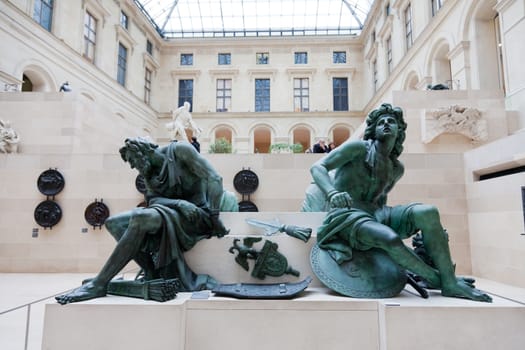 PARIS, FRANCE-OCTOBER 3 : Visitors in painting gallery on October 3, 2012 in Louvre Museum, Paris, France. With 8,5m annual visitors, Louvre is the most visited museum worldwide