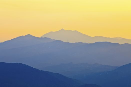 Foggy sunset on the mountains