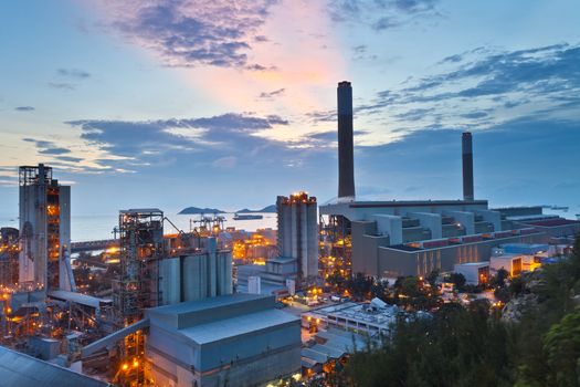 Power plant at sunset along coast