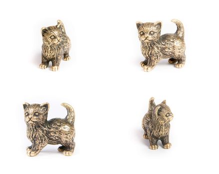 Bronze black cat statuette on the white background