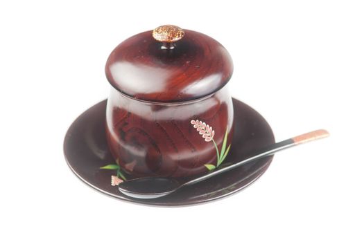 Traditoinal teacup, dish and spoon on white background