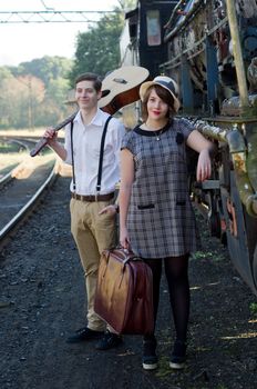 Retro hip hipster romantic love couple in vintage train setting