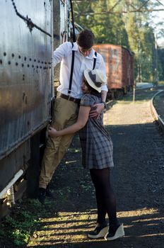 Retro hip hipster romantic love couple in vintage train setting