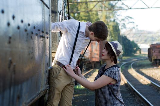 Retro hip hipster romantic love couple in vintage train setting