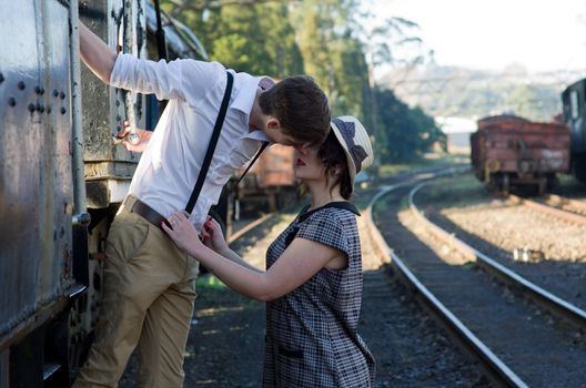 Retro hip hipster romantic love couple in vintage train setting