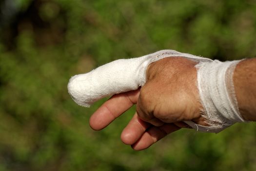 white medicine bandage on injury finger