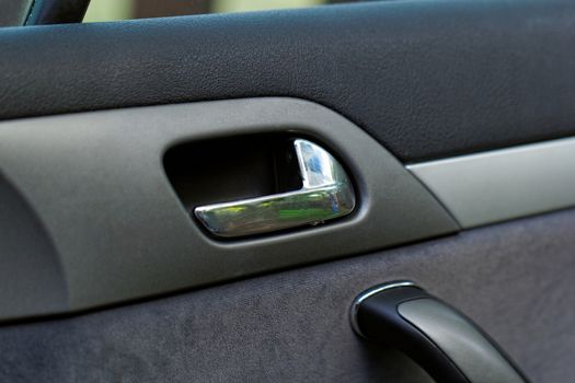 car door handle on a grey