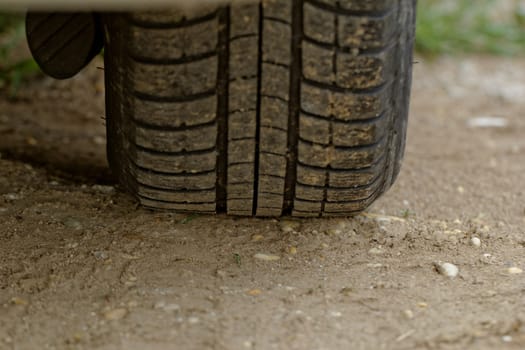 close up about car wheels on a dusty road