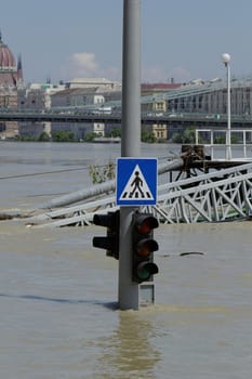 traffic light on flooding river