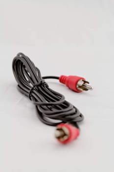 only red audio RCA cable on a white background (left)