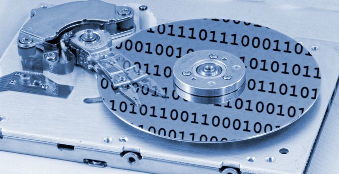 Internals of a computer harddrive with binary number reflections with blue colors (HDD, winchester)