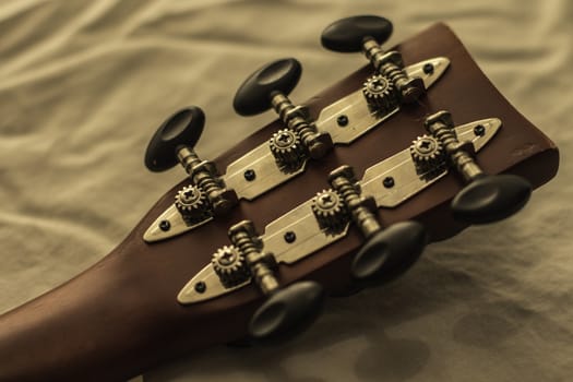 Detailed picture of an acoustic guitar headstock.