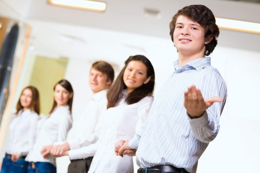 group of people holding hands, man holds out his hand, the concept of teamwork