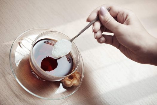 Human hands making tea