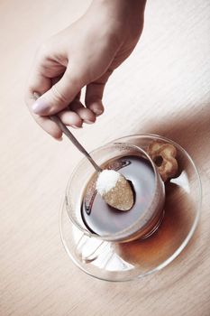 Human hands making tea