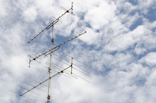 antenna tower under bright blue sky