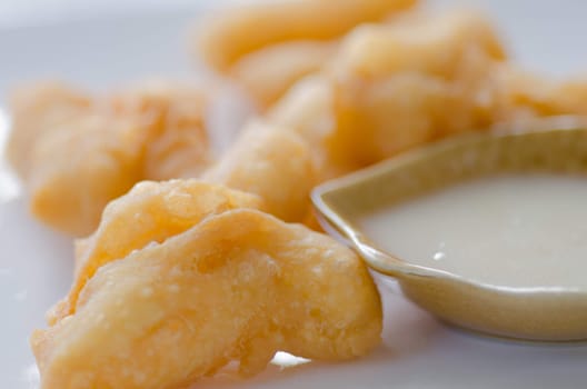 deep fried doughstick with sweetened condensed milk