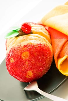 homemade cake as a peach with peach filling on white background