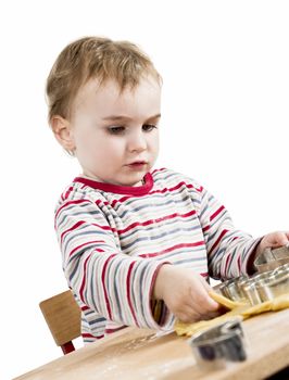 cute child with dough isolated on white background. horizontal image