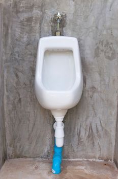 white urinal in public toilet