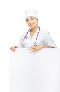 Smiling doctor with stethoscope holding blank billboard